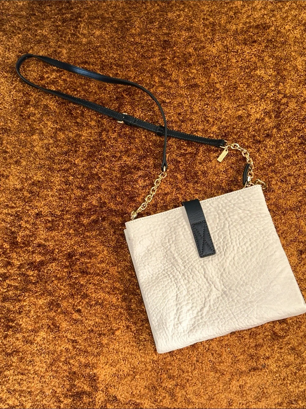 Cream Crossbody Bag with Black Strap and Gold Chain Accent